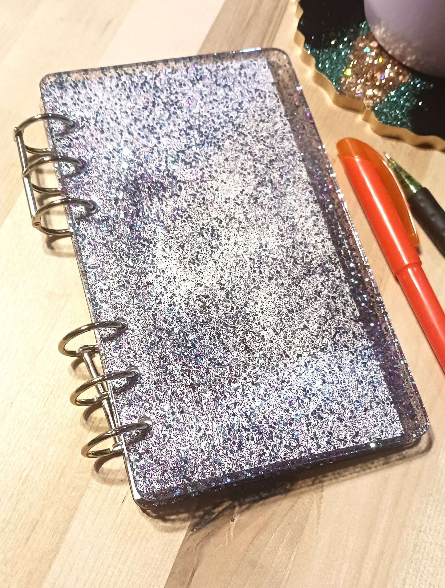 Clear resin notebook with blue and purple glitter