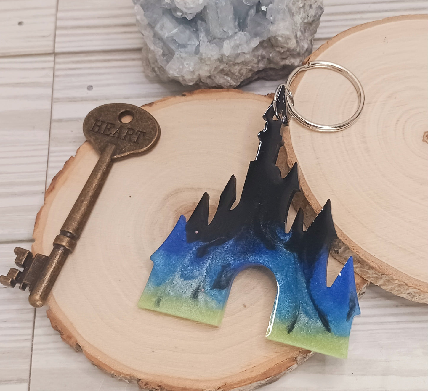 Princess castle shaped resin keychain with Northern Lights theme