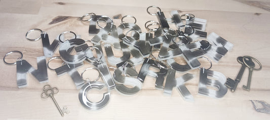 Letter keychains with cow print