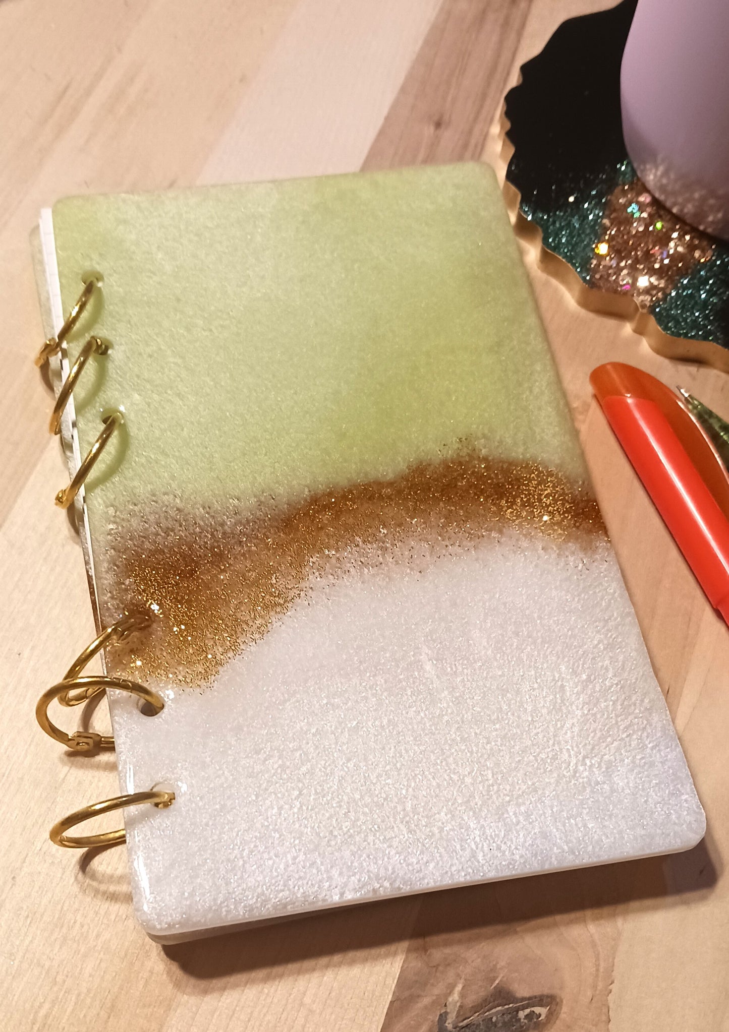 Green and white notebook with gold glitter accent