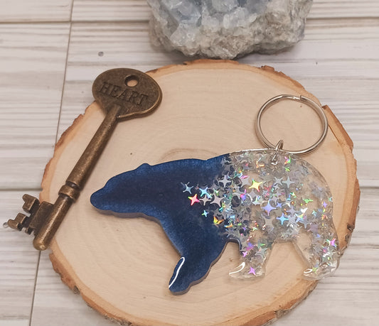 Bear resin keychain with a midnight sky theme