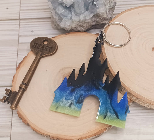 Princess castle shaped resin keychain with Northern Lights theme