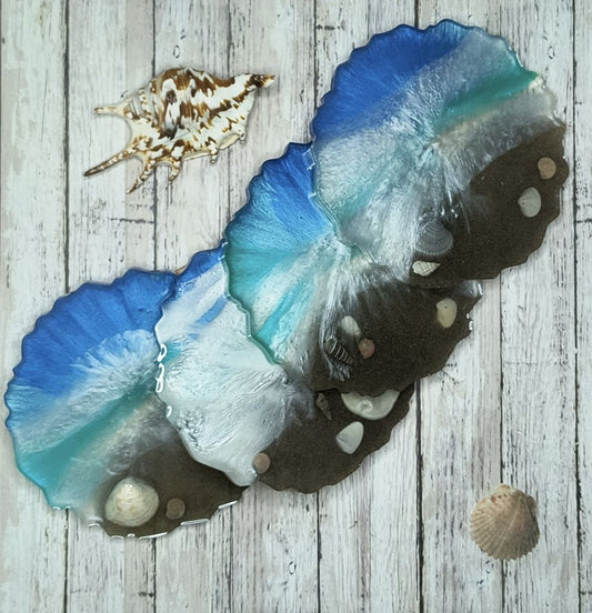 Ocean-themed resin coaster set with waves and shell accents, capturing coastal beauty for home decor